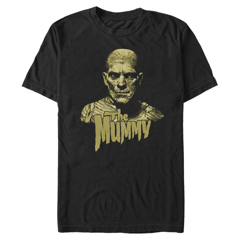 Black short-sleeved t-shirt featuring a yellow image of The Mummy with bandaged head and shoulders, with the text 'The Mummy' in yellow below.