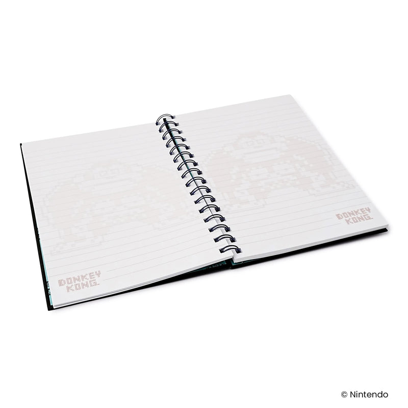 Open view of the spiral notebook showing lined pages with faded pixel-art Donkey Kong graphics and the text 'DONKEY KONG' in the corners.