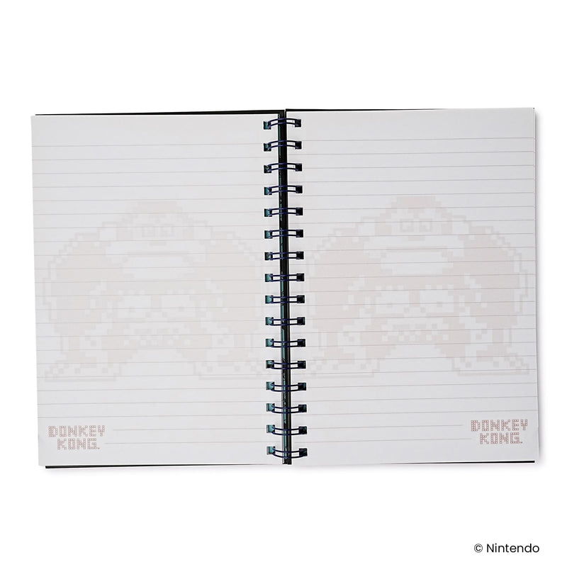 Open notebook to two lined pages with faint Donkey Kong pixel artwork and a small 'DONKEY KONG' logo in the lower corners.