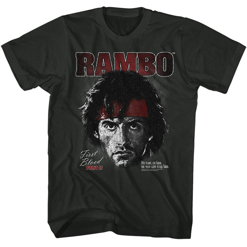 Black t-shirt featuring Rambo in a red headband with the text 'RAMBO' in red above and 'First Blood Part II' in script below.