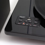 Close-up of the black Studebaker turntable control panel with power/standby, USB, record, repeat, and phono/aux buttons and indicator lights.