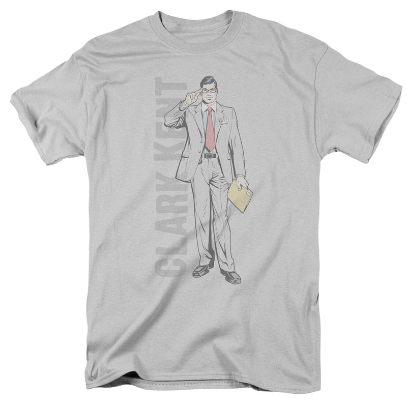 Silver short-sleeved t-shirt featuring a line drawing of Clark Kent in a suit and red tie with the text 'CLARK KENT' in gray vertically.