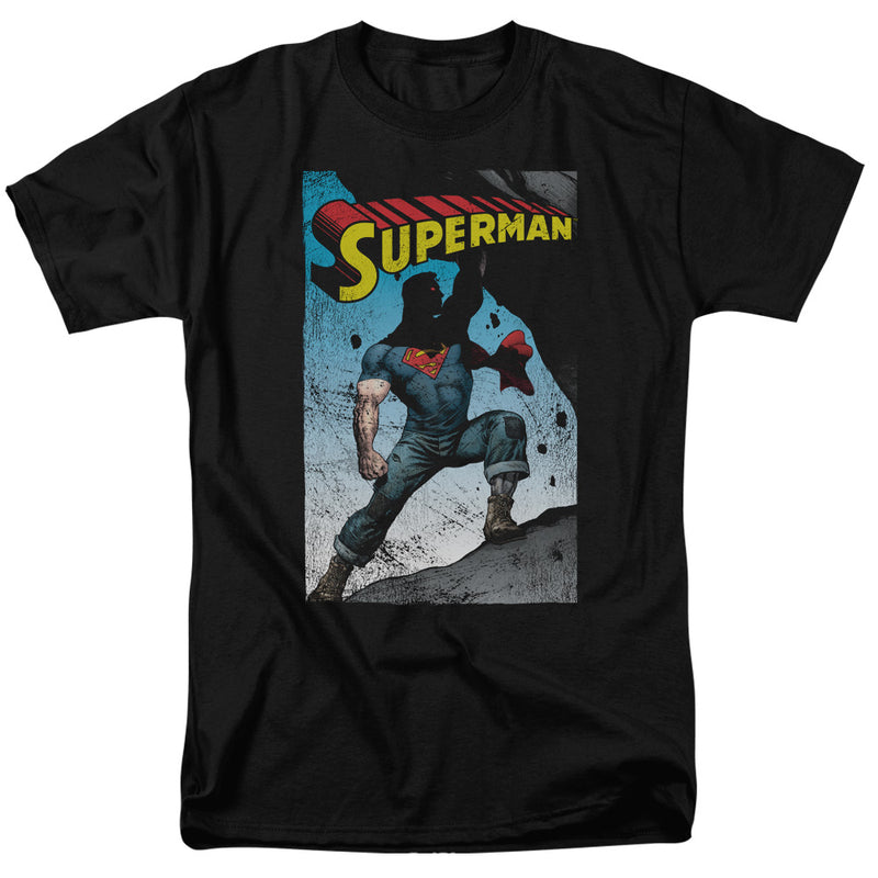 Black short-sleeved t-shirt featuring a comic-style Superman illustration in torn jeans with the text 'SUPERMAN' in yellow above it.