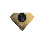 Back of the Superman flying logo pin showing the black clasp, the 'SUPERMAN' text, and a copyright line.