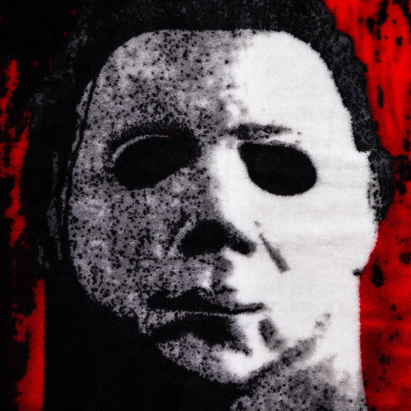 Halloween II "The Faces Of Michael Myers" Raschel Throw Blanket | 45 x 60 Inches