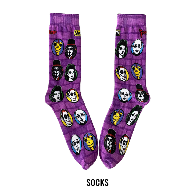 A pair of purple crew socks with a brick pattern and cartoon character prints of Svengoolie and the Sven Squad.