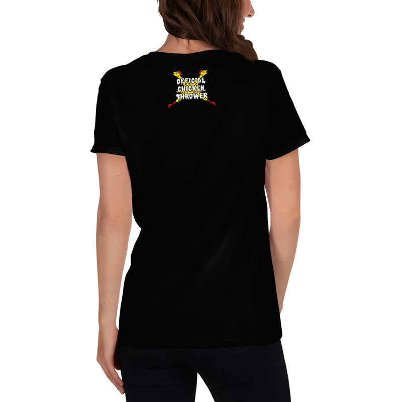 Back view of model wearing black short-sleeved t-shirt featuring crossed rubber chickens with the text 'OFFICIAL CHICKEN THROWER' in white above them.