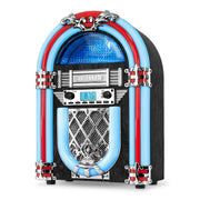 Angled view of the black Victrola jukebox speaker showing its blue and red LED tubes, chrome grille, and backlit radio display.