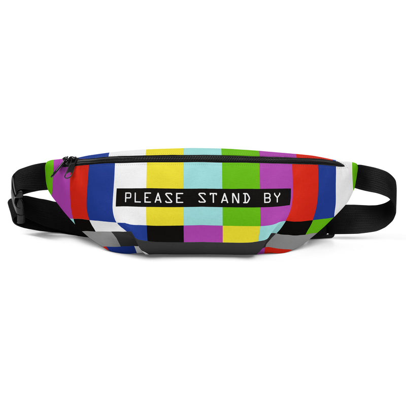Front view of a fanny pack with a TV test pattern of color bars featuring a black label with text 'PLEASE STAND BY' in white centered on the front.
