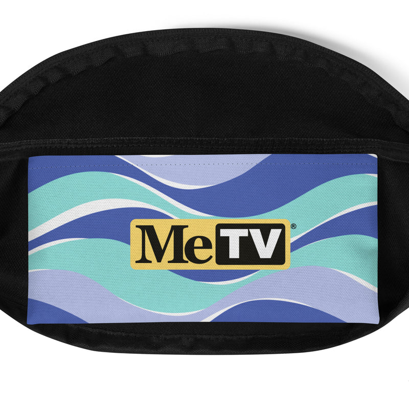 Interior view of multicolor fanny pack with wavy stripes of blue, with a yellow MeTV logo