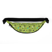 Front view of lime green fanny pack with a black zipper and black strap featuring a retro atomic pattern of black atom shapes, sparkles, and turquoise and white crescents.