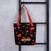 Black tote bag with red handles featuring an all-over pattern of red anatomical hearts and a small yellow MeTV logo near the bottom center.