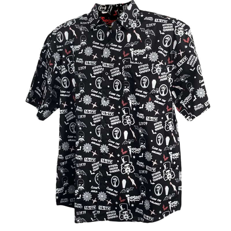 Front view of black short-sleeved button-up shirt featuring an all-over print of the Svengoolie face, bats, coffins and 'MeTV' logo in white.