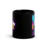 Side view of black ceramic mug with partial 'Toon In With Me' logo in white and yellow on the left and a neon-lit family portrait on the right
