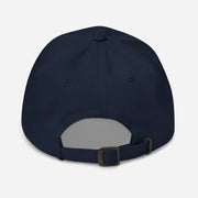 Back view of navy dad hat with an adjustable strap and metal buckle closure.