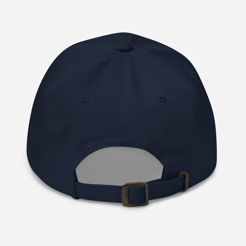 Back view of navy dad hat with an adjustable strap and metal buckle closure.