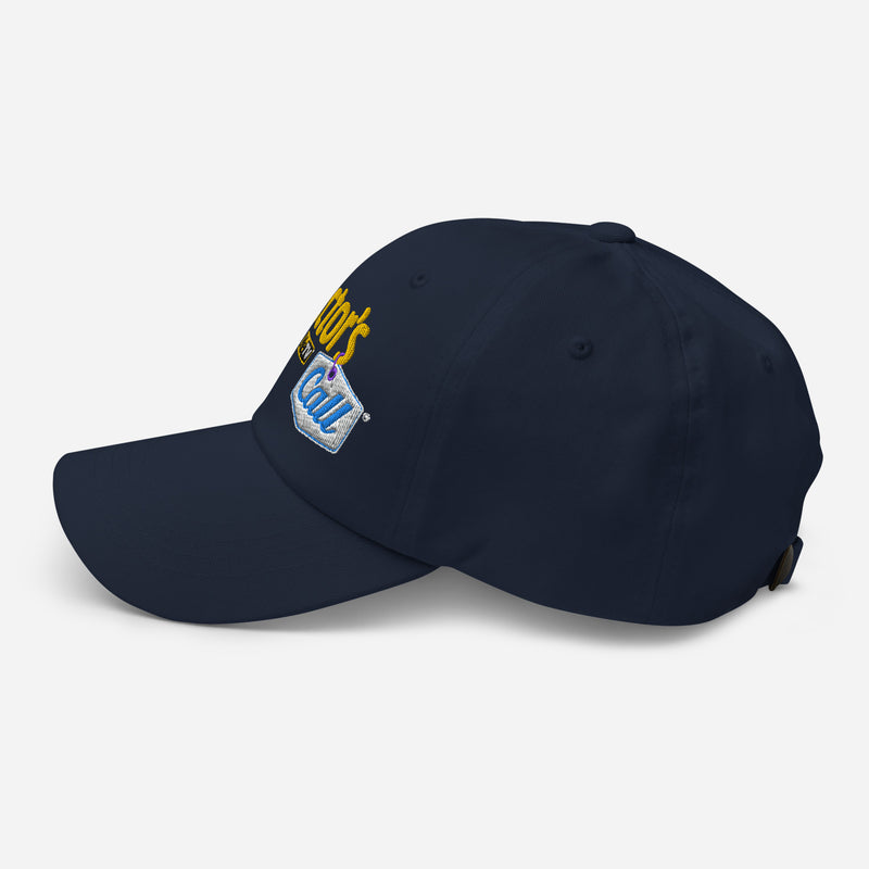 Side view of navy dad hat featuring the yellow Collector's Call logo embroidered across front panel