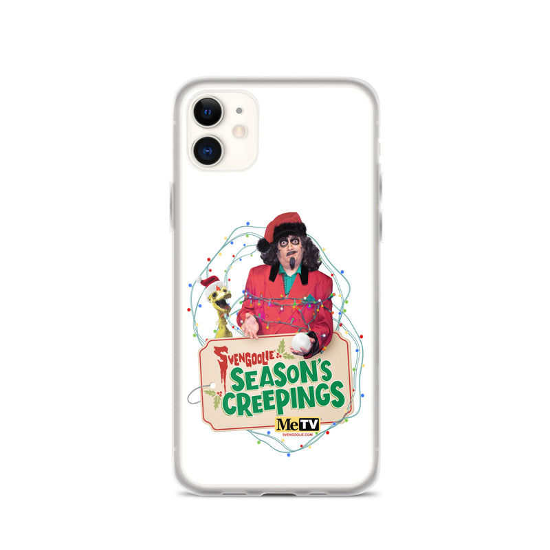 Front of a white iPhone 11 in the clear Sventa Claus case, showing the Svengoolie and Kerwyn artwork with the MeTV logo and website text below the sign.