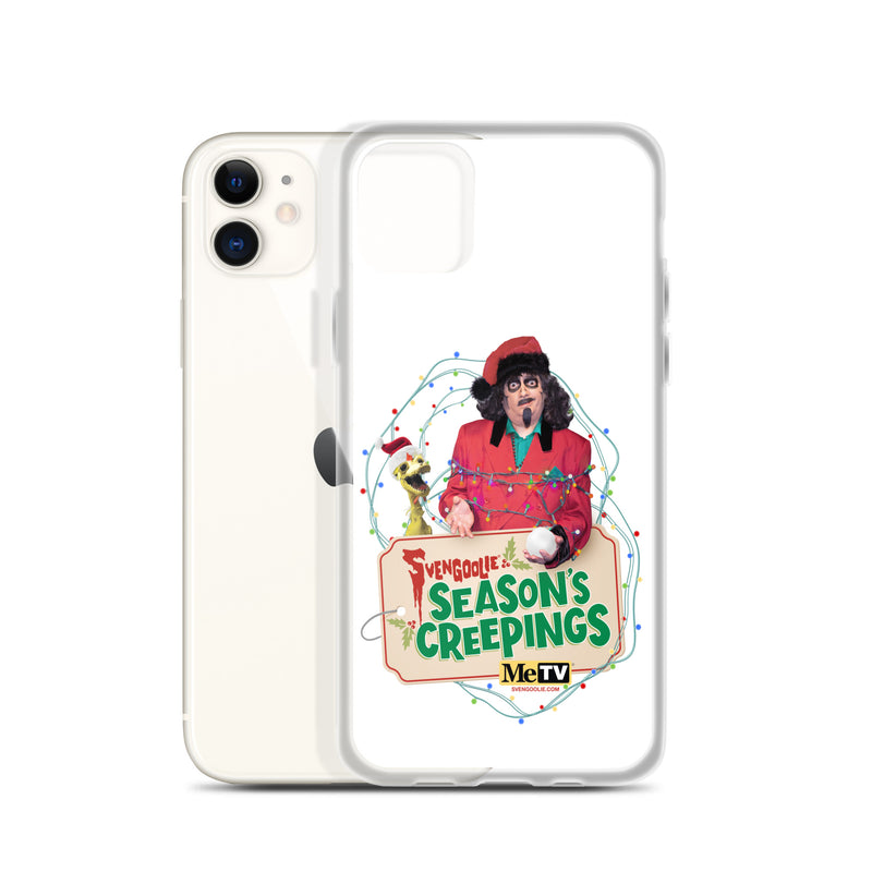 Angled view of the Sventa Claus case beside a white iPhone 11, showing the Svengoolie and Kerwyn artwork on the case's front.