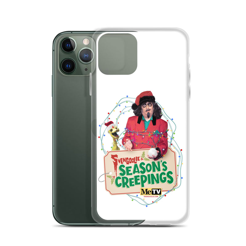 Side view of the Sventa Claus case beside a dark green iPhone 11 Pro, showing the clear case edges and the Svengoolie and Kerwyn artwork on the front.