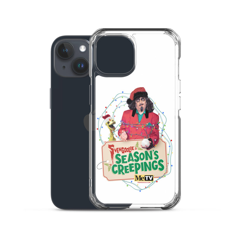 Angled view of the clear Svengoolie Christmas case on a navy iPhone, showing the raised camera lip and clear side edges.