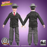 Front and back views of the Dizzy Doctors Moe action figure without packaging, showing the black double-breasted jacket, gray trousers, and gray fedora from both sides.