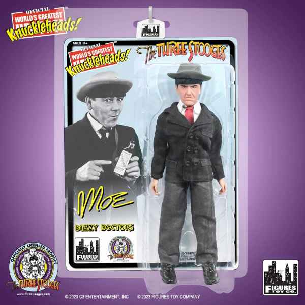 Front of packaged Moe action figure in black suit, gray fedora, and red tie, with the text 'Moe' in yellow script on the card beside the 'The Three Stooges' logo.