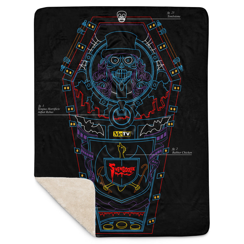 Black throw blanket with blue, red, and purple line art of a coffin, top-hat skeleton, and 'Svengoolie' logo. folded corner showing sherpa lining