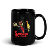 Angled view of black ceramic mug with a Svengoolie character illustration featuring Svengoolie reaching forward and holding a yellow chicken, with the text 'Svengoolie' in red below him.