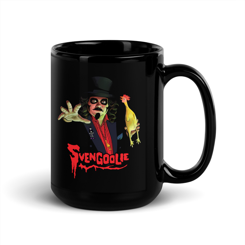 Angled view of black ceramic mug with a Svengoolie character illustration featuring Svengoolie reaching forward and holding a yellow chicken, with the text 'Svengoolie' in red below him.
