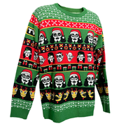 3/4 view of green knit holiday sweater featuring rows of Svengoolie character faces, some in Santa hats, with red, black, yellow and green gift boxes