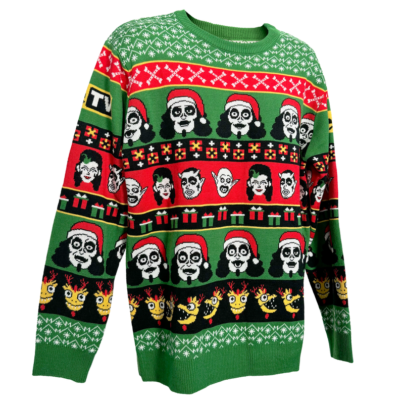 3/4 view of green knit holiday sweater featuring rows of Svengoolie character faces, some in Santa hats, with red, black, yellow and green gift boxes