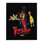 Black throw blanket with a Svengoolie character illustration featuring Svengoolie reaching forward and holding a yellow chicken, with the text 'Svengoolie' in red below him.
