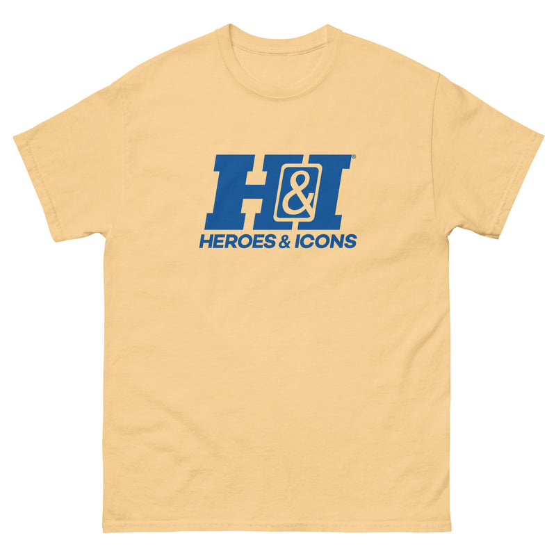 Pale yellow short-sleeved t-shirt featuring the Heroes & Icons logo with the text 'HEROES & ICONS' in blue below a large blue 'H&I' monogram.