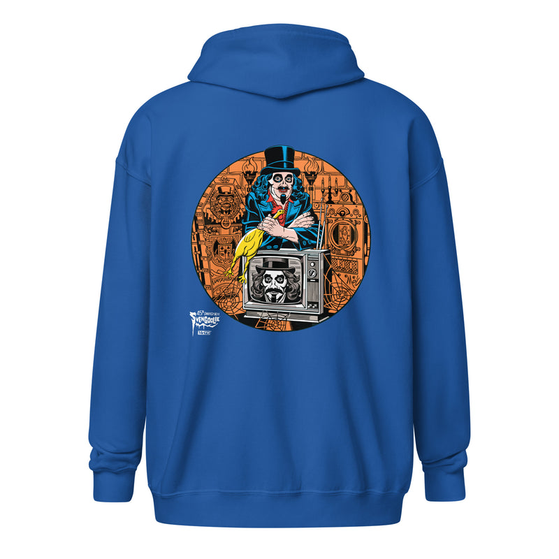 Back view of royal blue zip-up hoodie featuring Svengoolie holding a rubber chicken, by a TV with Orange circle border. Svengoolie logo at lower left.