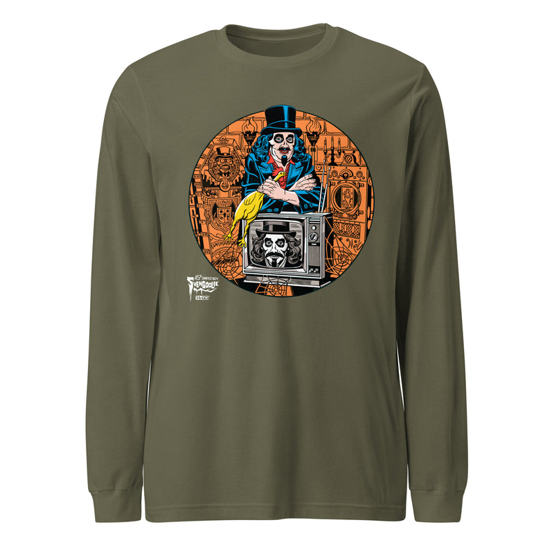 Green long-sleeved shirt illustrated Svengoolie holding a rubber chicken, and TV with Orange circle border, with white Svengoolie logo at lower left.