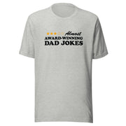 Heather gray t-shirt featuring a three-of-five star rating graphic with the text 'Almost AWARD-WINNING DAD JOKES' in black on the chest.