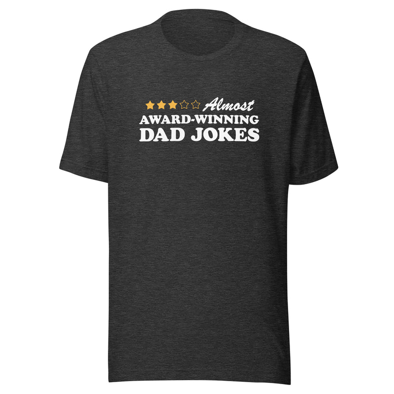 Dark gray heather short-sleeved t-shirt featuring a three-of-five star rating graphic with the text 'Almost AWARD-WINNING DAD JOKES' in black on the chest