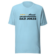 Light blue short-sleeved t-shirt featuring a three-of-five star rating graphic with the text 'Almost AWARD-WINNING DAD JOKES' in black on the chest