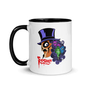 Front view of white mug with black handle and interior featuring Svengoolie in a top hat with curly hair, and the faces of the Sven Squad in his hair, with the text 'Svengoolie' in red.