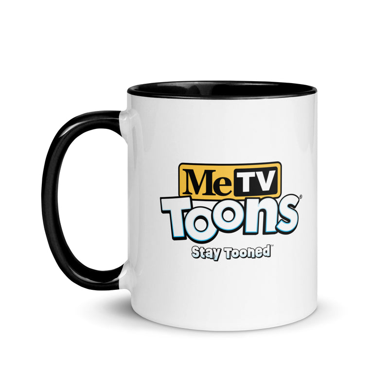 White ceramic mug with black handle and blue interior featuring the MeTV Toons logo with the text 'Stay Tooned' in black below it.