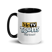 White ceramic mug with black interior and handle featuring the MeTV Toons logo with the text 'MeTV Toons' and 'Stay Tooned' in black and blue below it