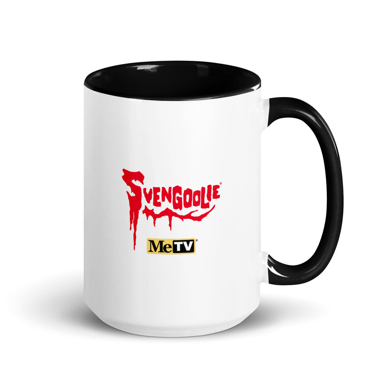 Back view of white ceramic mug with a black interior and handle featuring the red dripping Svengoolie logo with the MeTV logo below it.
