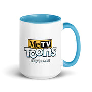 White ceramic mug with blue interior and handle featuring the MeTV Toons logo with the text 'MeTV Toons' and 'Stay Tooned' in black and blue below it