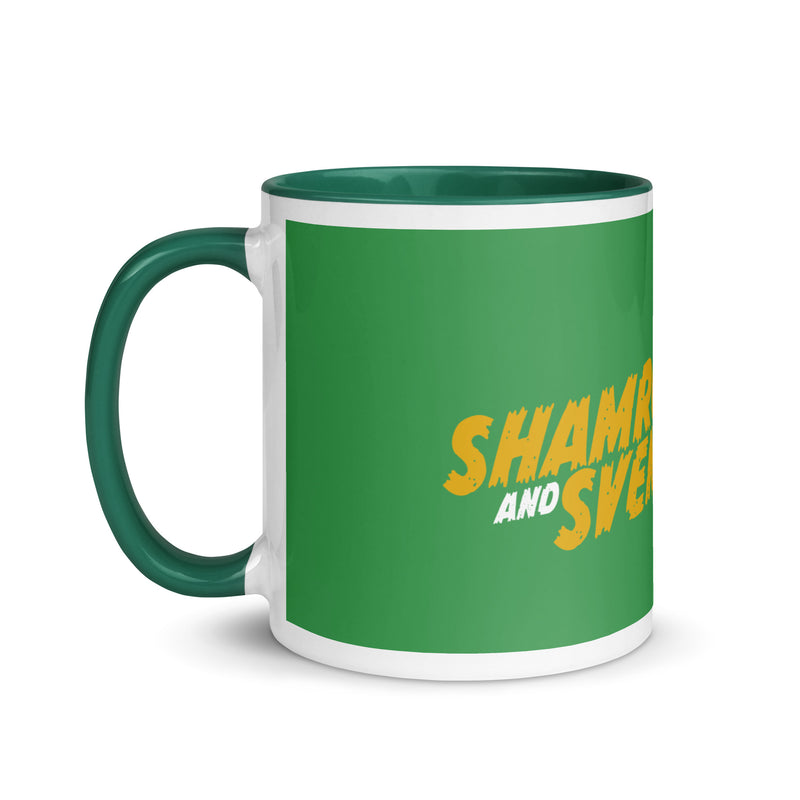 Side view of a green mug with a dark green handle and interior featuring yellow logo text.