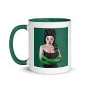 White mug with green interior and handle, featuring an illustrated Gwengoolie portrait in a black dress and green gloves on green.