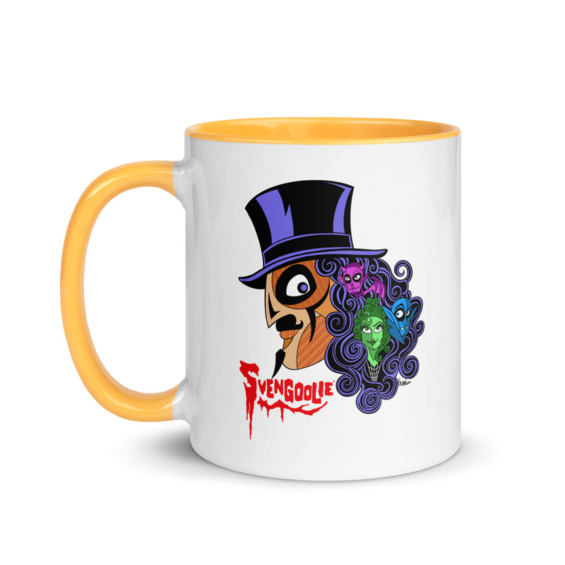 Front view of white mug with yellow handle and interior featuring Svengoolie in a top hat with curly hair, and the faces of the Sven Squad in his hair, with the text 'Svengoolie' in red.