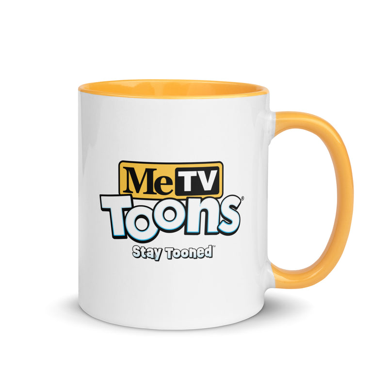 White ceramic mug with yellow handle and blue interior featuring the MeTV Toons logo with the text 'Stay Tooned' in black below it.
