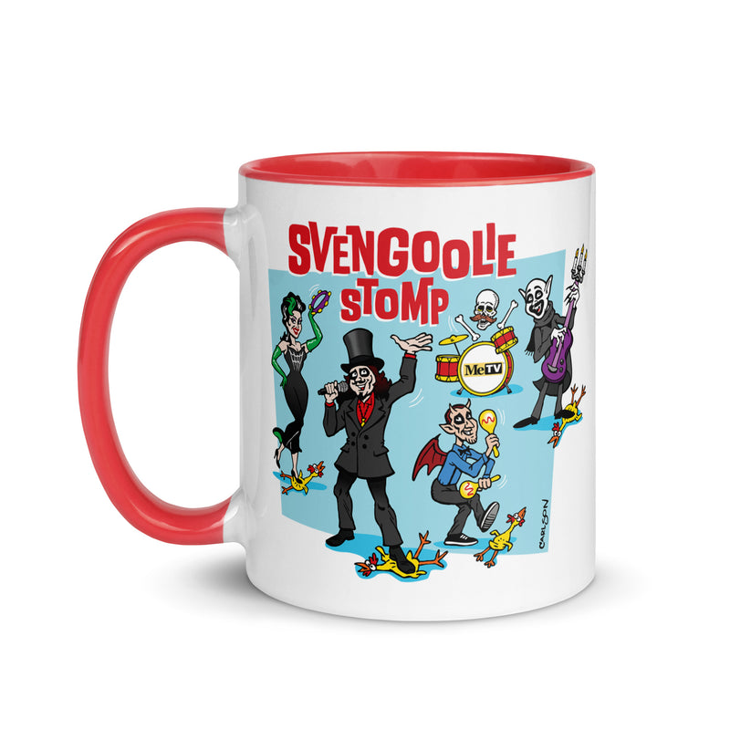White mug with red handle and interior featuring a cartoon band of Svengoolie characters with red SVENGOOLIE STOMP text and Svengoolie logo to left