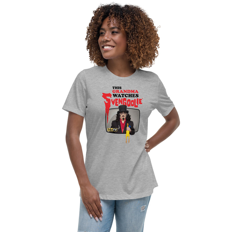 Model wearing green t-shirt featuring Svengoolie holding a rubber chicken with the text 'This Grandma Watches Svengoolie' in black and red above it.